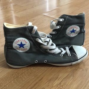 Grey Converse sneakers.